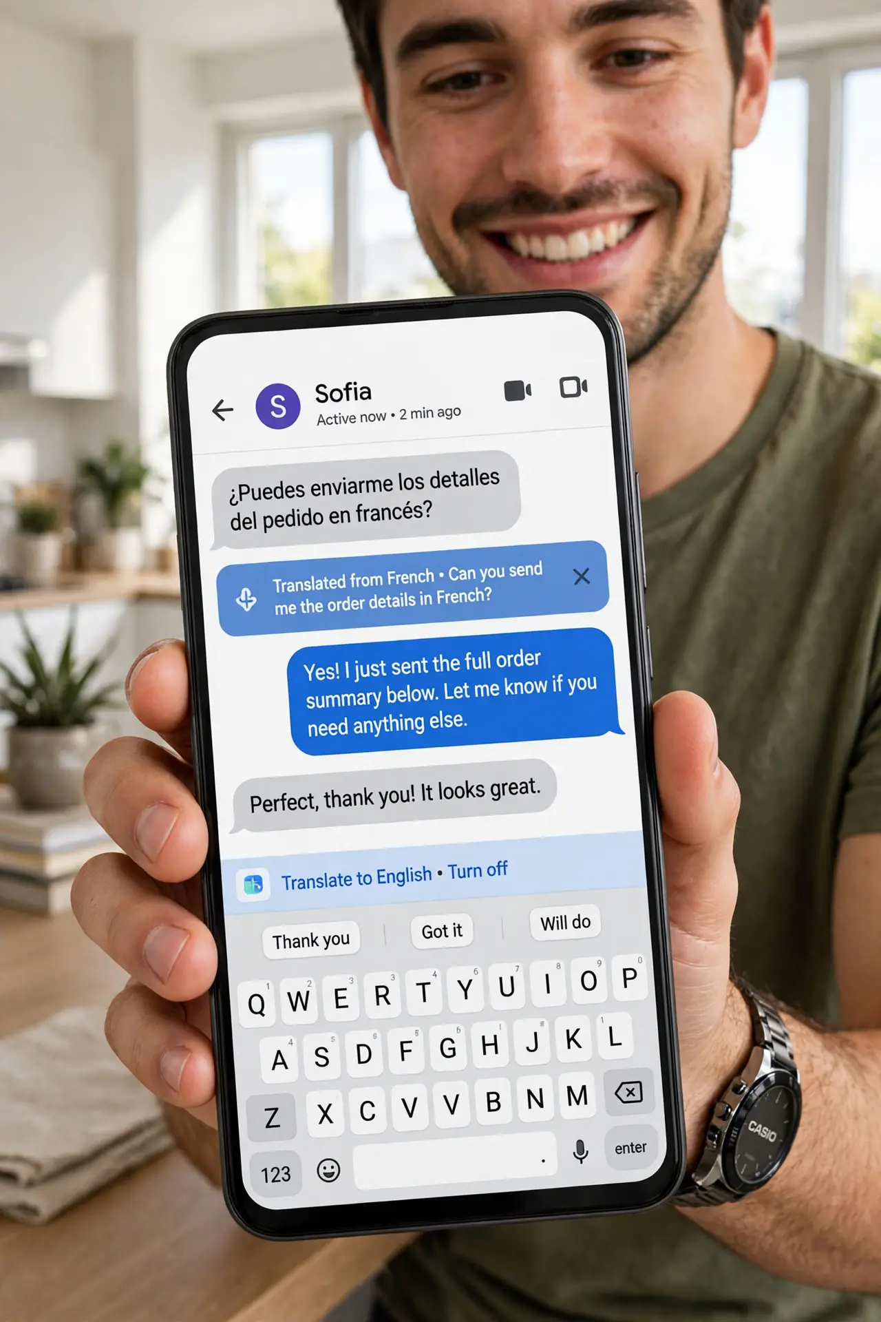 a person holding a real Android phone showing Gboard with the translate bar visible and translated text legible in a chat app, the person's face pleased, bright room. No black scre.