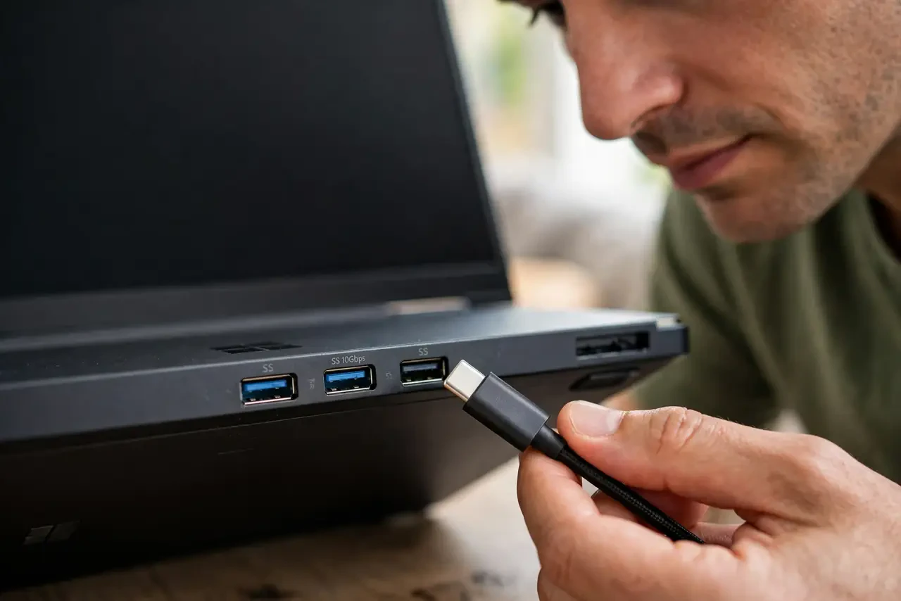 A person performing step 1: Identify the port you are using.