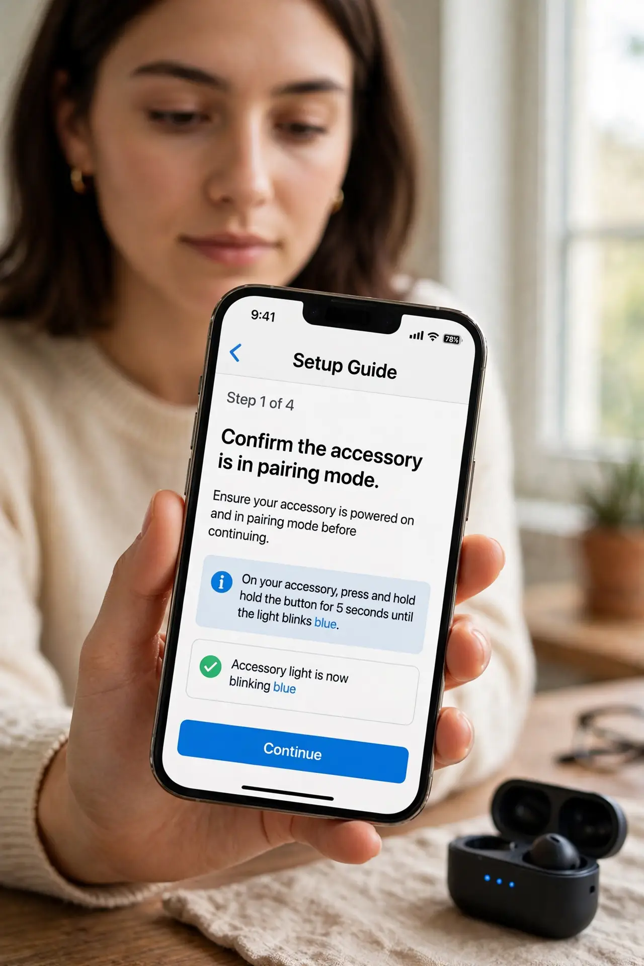 A person doing the guide's first step: Confirm the accessory is in pairing mode.